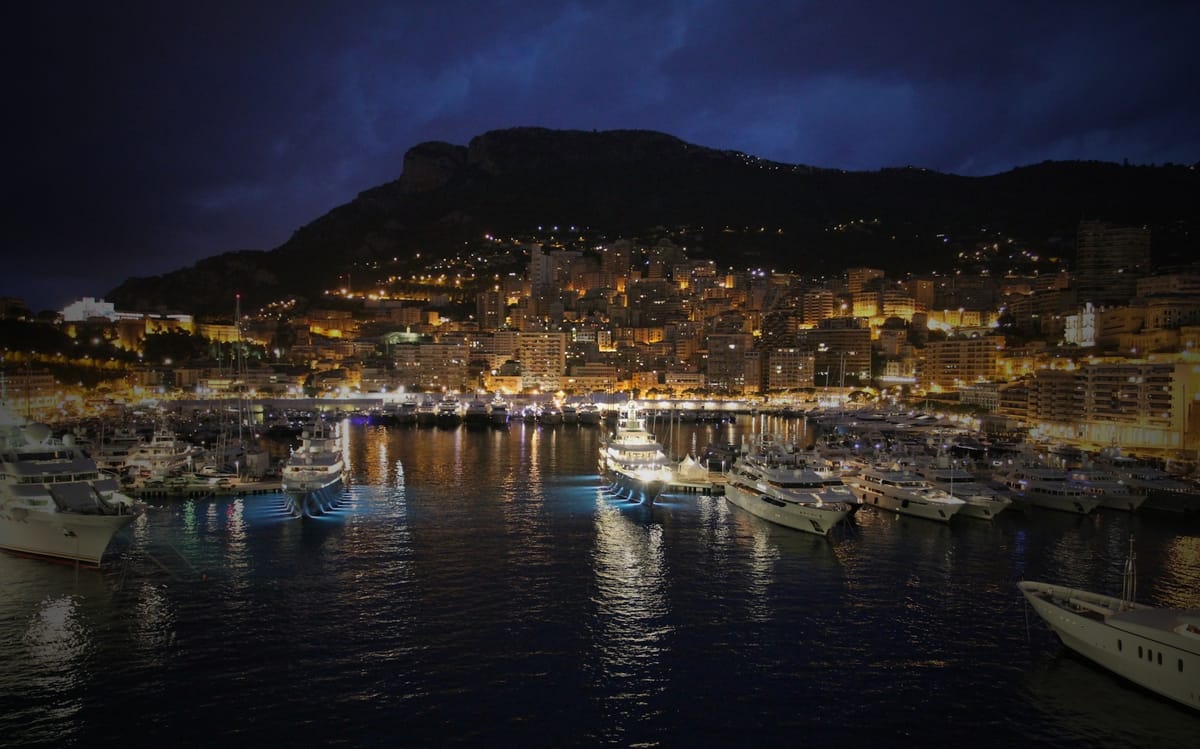 A beautiful marina full of yachts at night