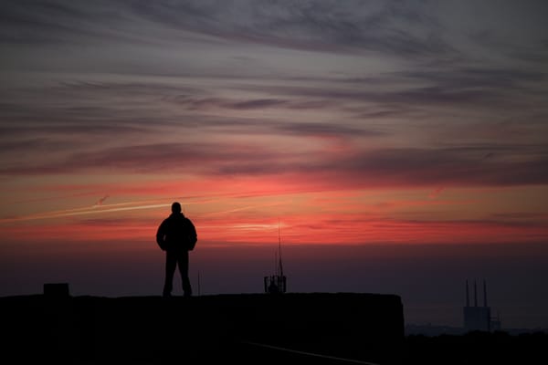 A man searching for meaning at sunset